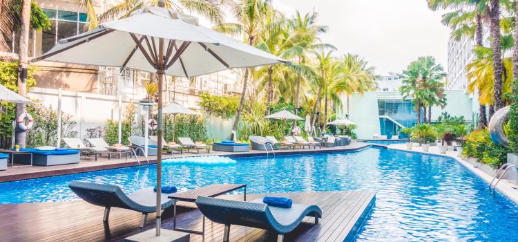 Umbrella pool and chair around beautiful luxury swimming pool in hotel resort - Vintage Light film Filter