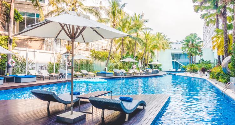 Umbrella pool and chair around beautiful luxury swimming pool in hotel resort - Vintage Light film Filter